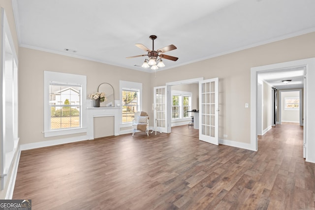 unfurnished living room with french doors, dark hardwood / wood-style flooring, ceiling fan, and crown molding