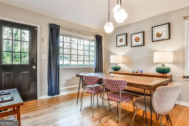 dining space featuring light hardwood / wood-style floors and plenty of natural light