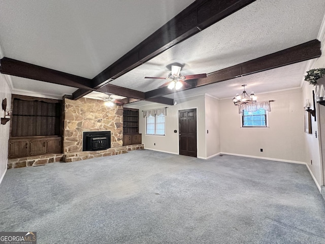 unfurnished living room with carpet floors, a fireplace, beam ceiling, a textured ceiling, and ceiling fan with notable chandelier