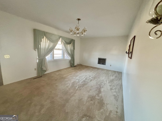 unfurnished living room featuring carpet and a chandelier