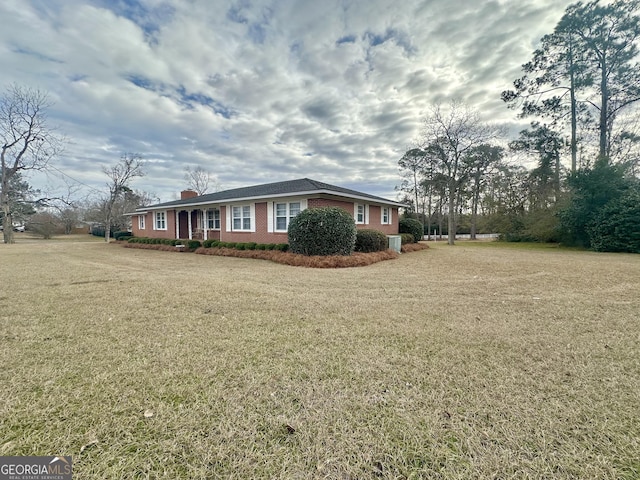 view of home's exterior with a lawn