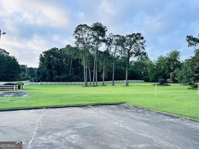 view of property's community with a lawn