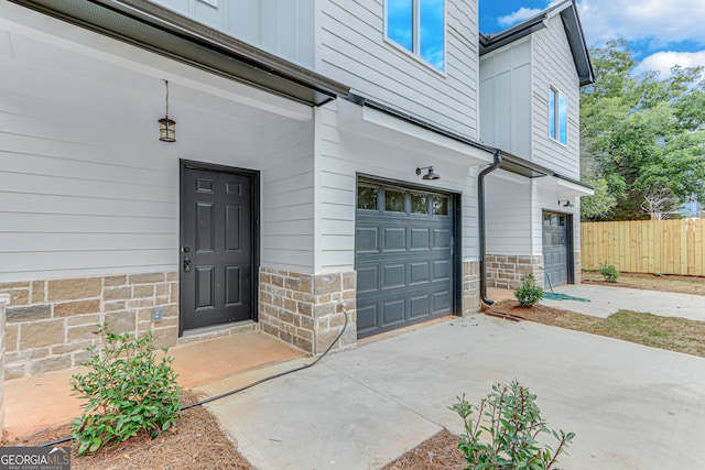 view of exterior entry with a garage