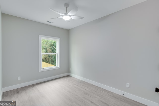 unfurnished room with ceiling fan and light hardwood / wood-style flooring