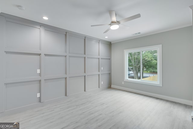 interior space with ornamental molding and ceiling fan