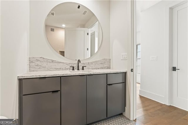 bathroom featuring hardwood / wood-style floors and vanity