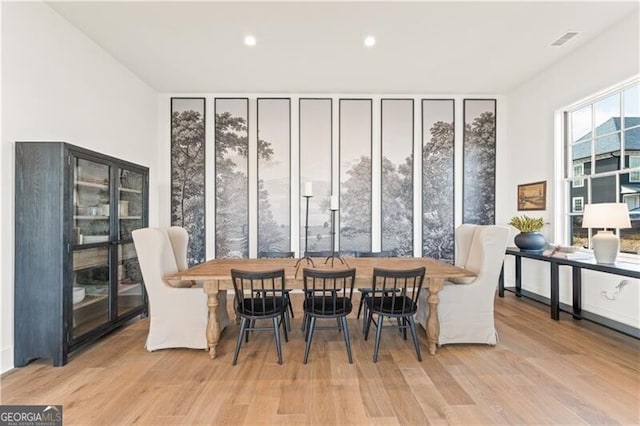 dining area with light hardwood / wood-style floors