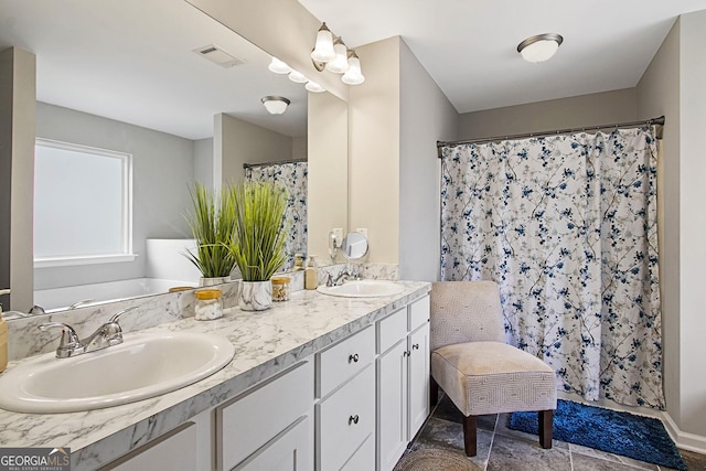 bathroom featuring a shower with curtain and vanity