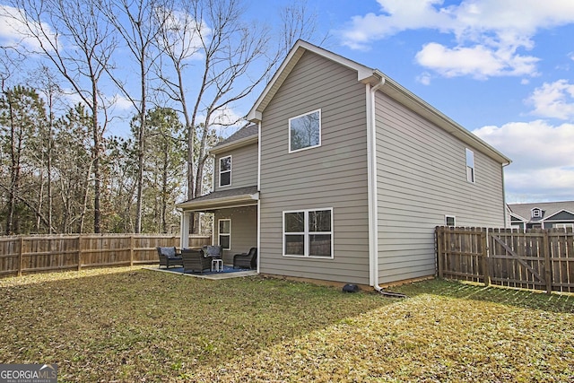 rear view of property with a patio, a lawn, and outdoor lounge area