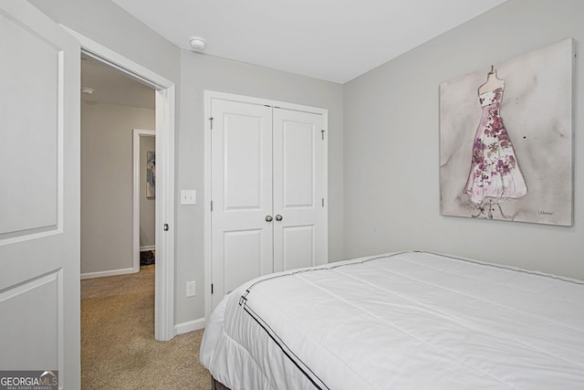 carpeted bedroom with a closet