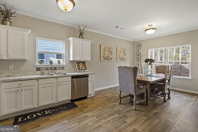 kitchen featuring dishwasher, crown molding, dark hardwood / wood-style flooring, white cabinetry, and sink