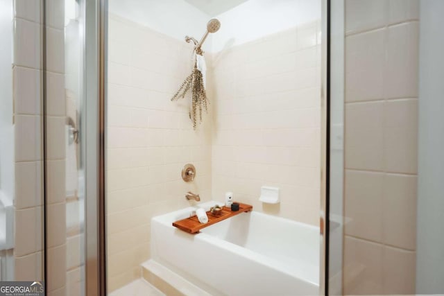 bathroom featuring shower with separate bathtub