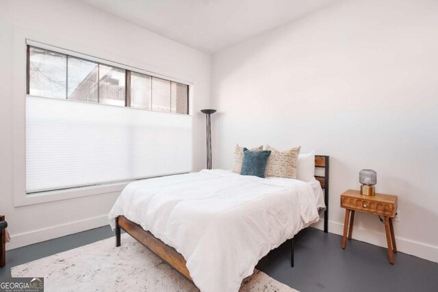 bedroom with concrete flooring