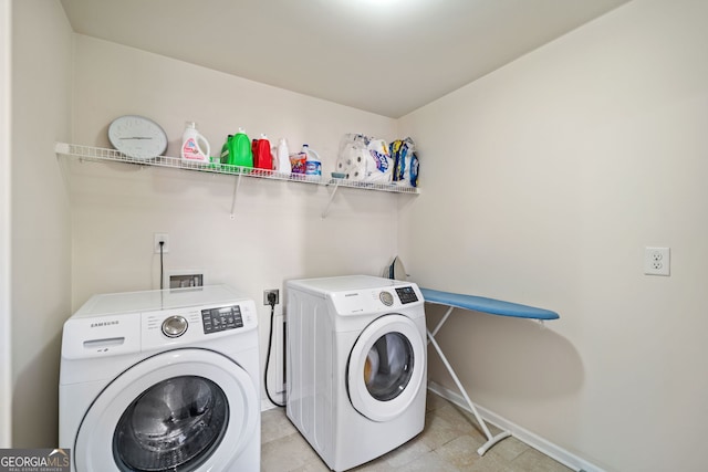 washroom with washer and dryer