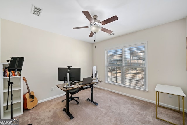 home office featuring light colored carpet and ceiling fan