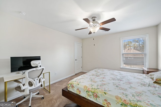 bedroom featuring light colored carpet and ceiling fan