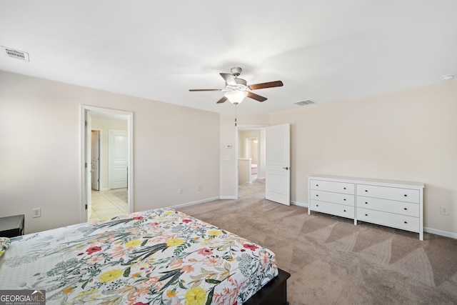 bedroom with light colored carpet and ceiling fan