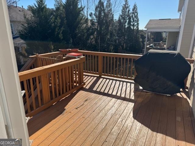 wooden deck with grilling area