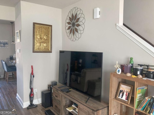 living room featuring dark wood-type flooring