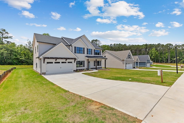 view of front of house featuring a front lawn and a garage