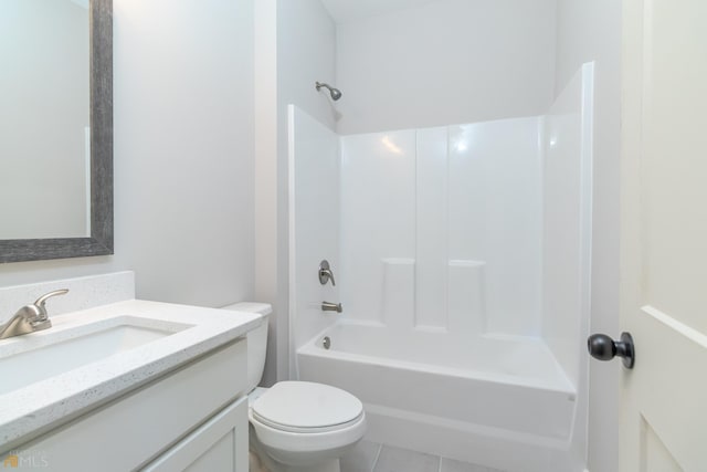 full bathroom featuring tub / shower combination, tile patterned flooring, vanity, and toilet