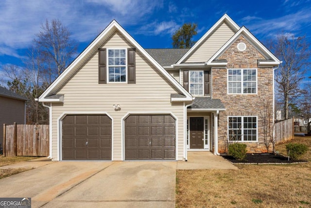 front of property with a garage and a front lawn