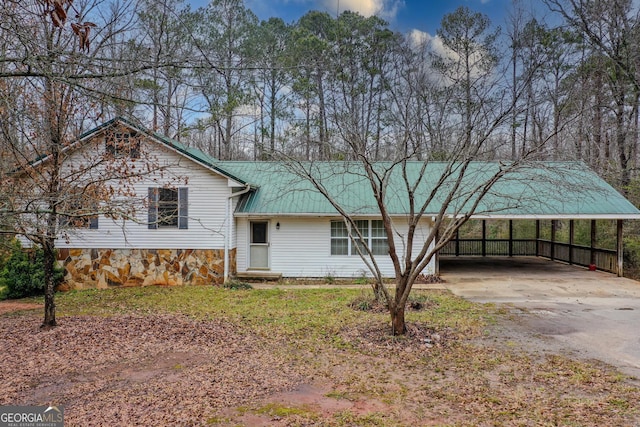 view of front of property with a carport