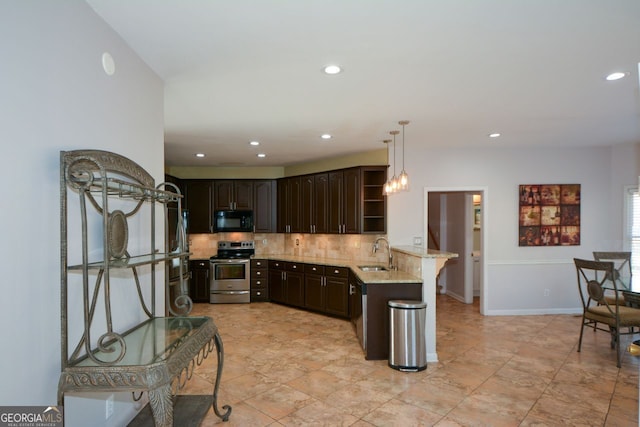 kitchen with sink, tasteful backsplash, dark brown cabinets, appliances with stainless steel finishes, and kitchen peninsula