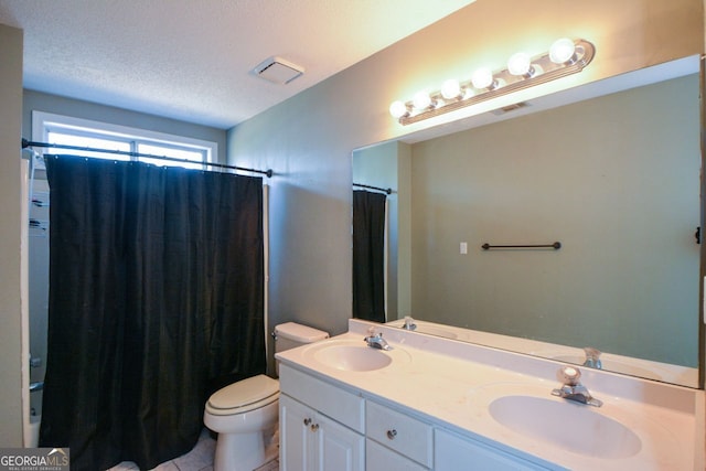 103 Ashwood Ct N, Stockbridge, GA 30281 - bathroom featuring double vanity, a textured ceiling, and shower / tub combo