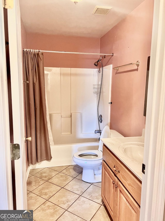 full bathroom with toilet, tile patterned flooring, vanity, and shower / tub combo with curtain