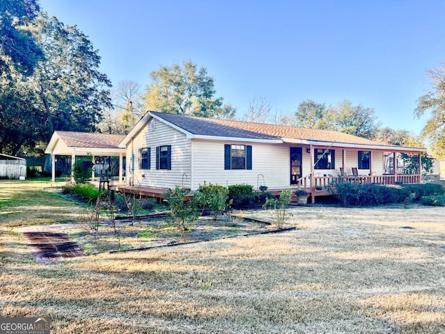 ranch-style home featuring a porch and a front lawn