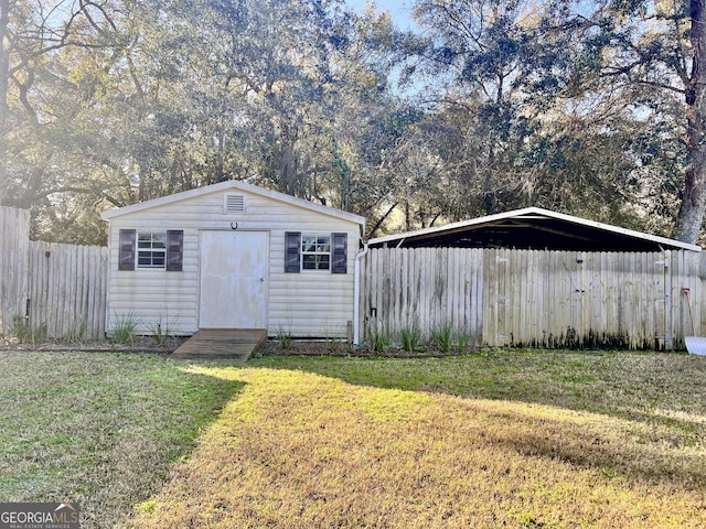 view of outbuilding featuring a yard