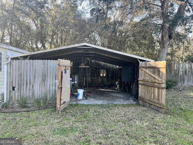 view of outbuilding with a lawn