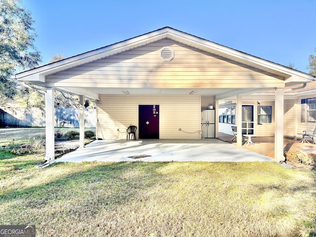 view of front of house featuring a front yard and a patio