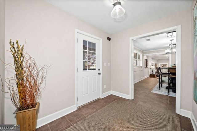 entryway featuring a chandelier