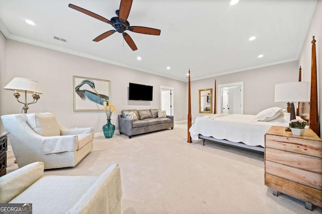 carpeted bedroom featuring ceiling fan and crown molding