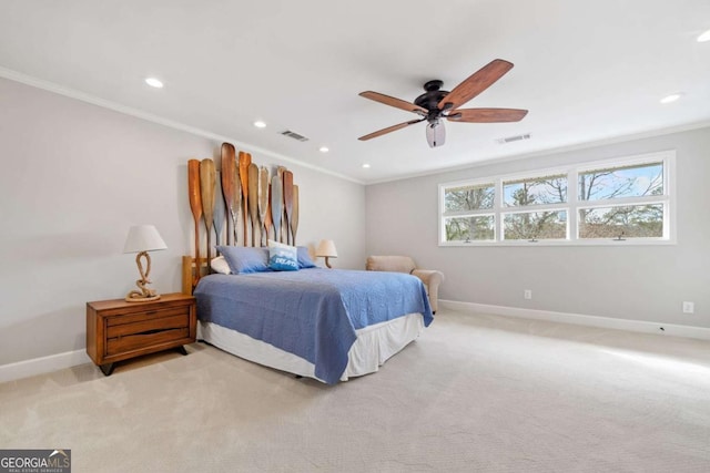 carpeted bedroom with ceiling fan and crown molding