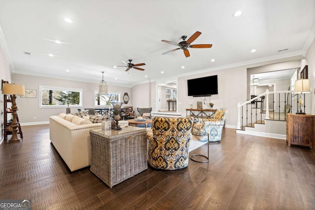 living room with ceiling fan, ornamental molding, and dark hardwood / wood-style flooring