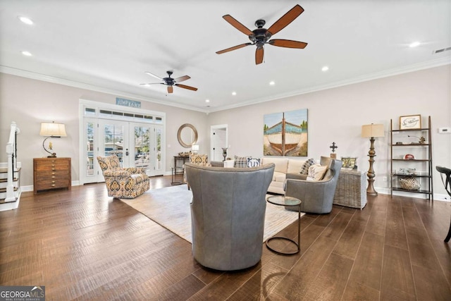 living room with french doors, ornamental molding, ceiling fan, and dark wood-type flooring