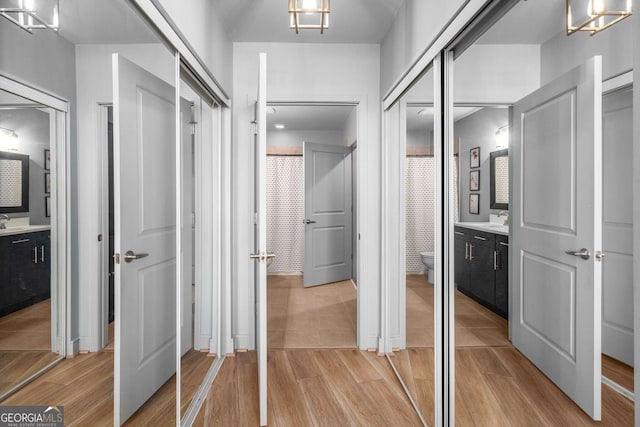 interior space featuring sink and a chandelier