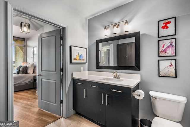 bathroom featuring toilet and vanity