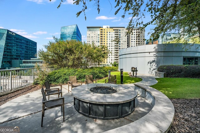 view of patio with a fire pit