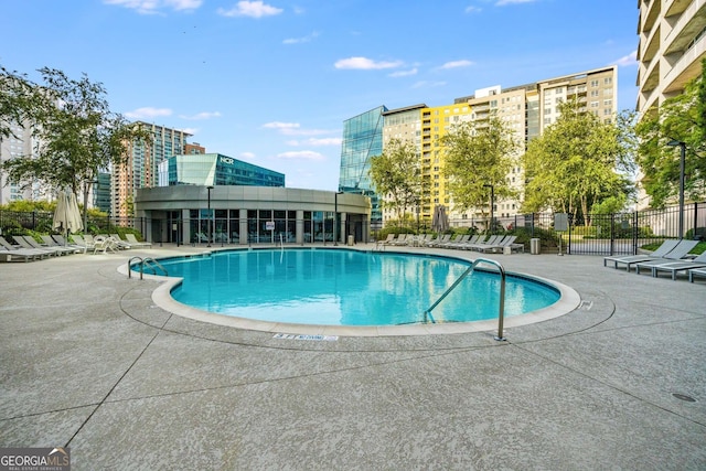 view of swimming pool featuring a patio