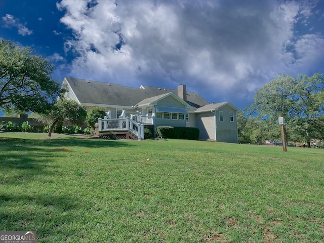 exterior space with a yard and a deck