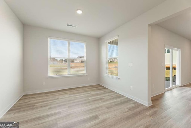 unfurnished room featuring light wood-type flooring