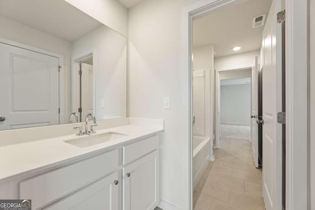 bathroom with vanity and tile patterned floors