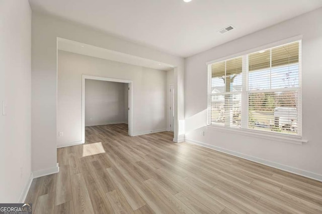 unfurnished room with light hardwood / wood-style floors