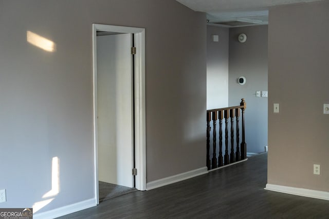 empty room featuring dark wood-type flooring