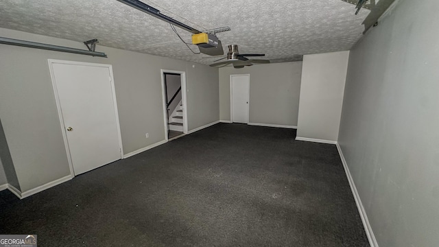 garage with ceiling fan and a garage door opener