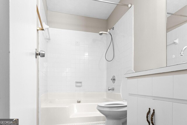 bathroom featuring toilet and bathing tub / shower combination